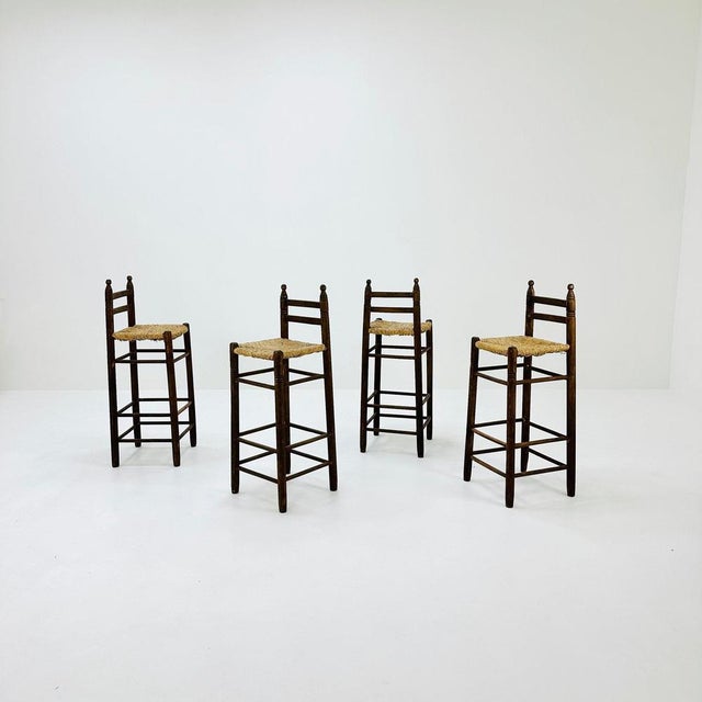 Mid century wood/wicker bar stools , 1960s, Italy This high chair/ bar stool shows the design language and materiality of...