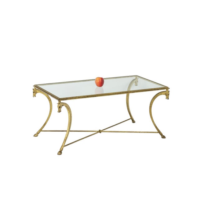 Jean-charles moreux for maison ramsay, in the style of. Rectangular coffee table in gilt iron standing on four curved legs...