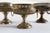 The three brass risers are coordinated to hold small jewelry and objects and were kept on toilets. One features glass and...