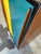 Fantastic MCM two-tone armoire cabinet, featuring turquoise and yellow sliding doors that open to shelving on one side and...