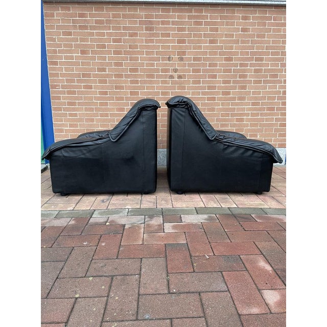 Couple of armchairs late 70s early 80s in real black leather. Comfortable and in good condition considering usury and use.