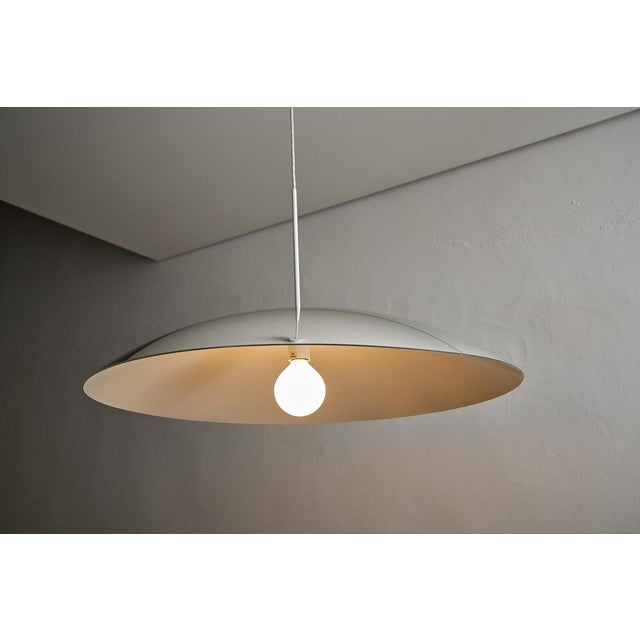 This large pendant lamp, by Fog & Mørup, creates an immediate visual impact with its impressive scale and finish....
