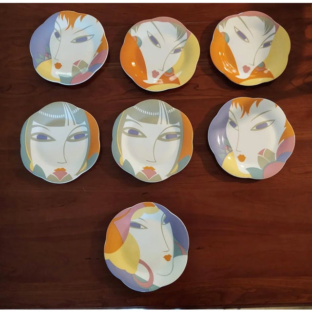 This is a very fun and vibrant set of salad plates (7) and a cream and sugar set. The salad plates include four different...