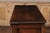An English oak geometric front server from the late 19th century, with two drawers, carved apron, turned legs and side...