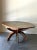 Solid oak dining table with six sculptural leg and a curved octagonal top. Features a speckled sage tile top with floral...