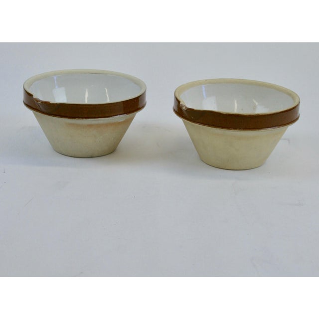 5 French Art Deco mixing bowls. 3 different sizes - 2 small - 2 medium - 1 large. The exterior is a buff unglazed surface...