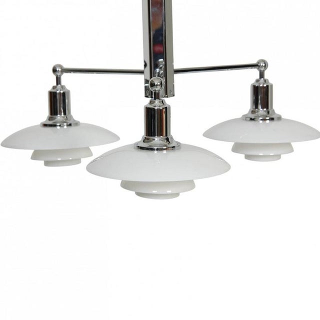 Poul henningsen ph2/1 stemfitting chandelier with white opal glass shades and a chrome frame. The lamp is from around 2010...