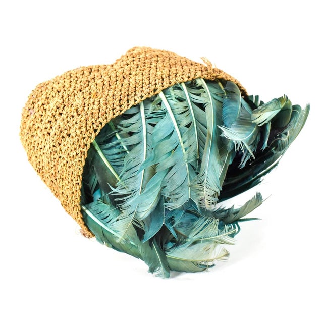 This authentic, teal and purple-feathered headdress is made of wild birds indigenous to the Cameroon Grasslands region...