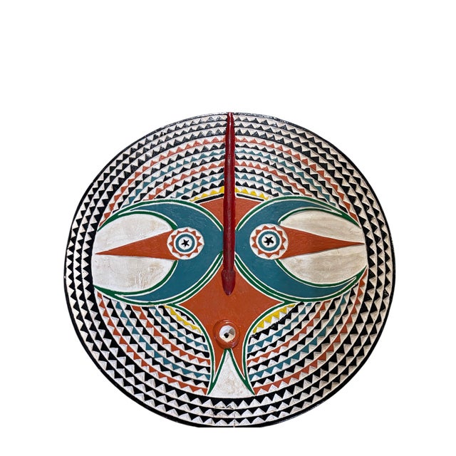This striking vintage Bobo sun mask from Burkina Faso is hand-carved from wood and finished with an aged, multi-colored...