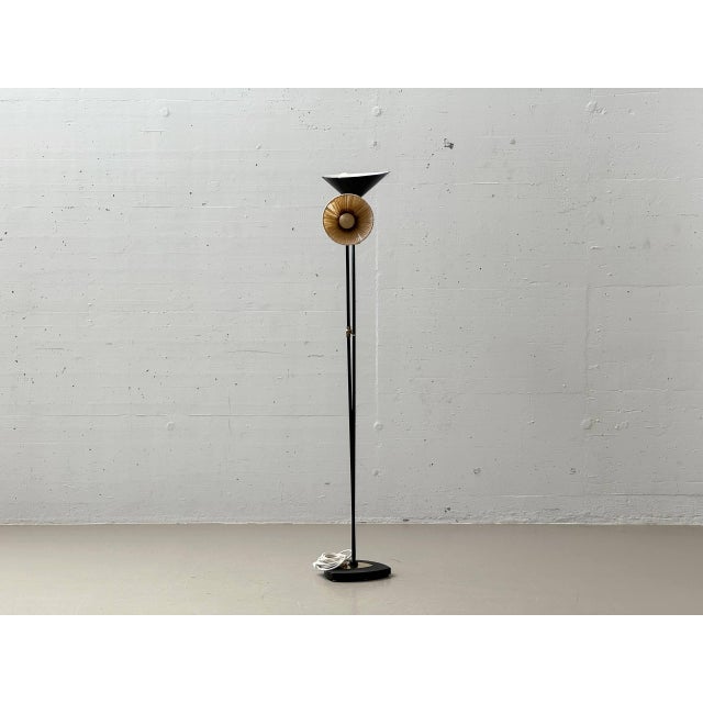A rare mid-century design floor lamp by the swiss manufacturer bag turgi from the 1950s. The lamp is characterized by its...