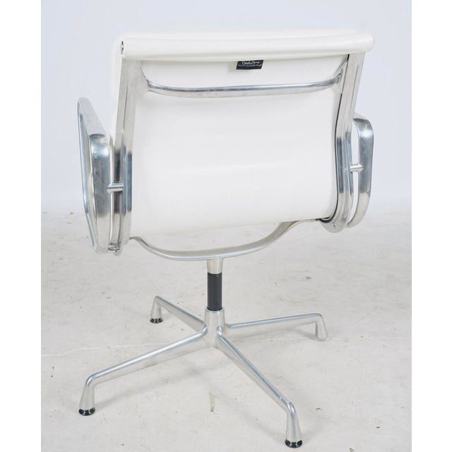An icon of 20th-century modern design in an especially crisp white-and-polished-aluminum combination. Authentic Charles...