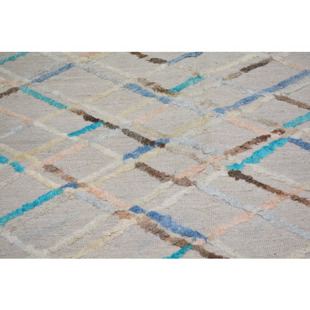 Hand-knotted with care using traditional rug-making techniques, this wool rug blends timeless craftsmanship with a modern...