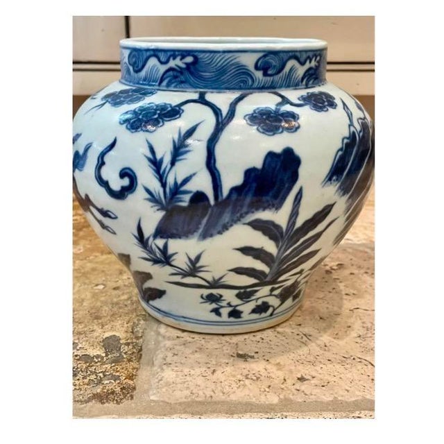 Antique Chinese blue-and-white porcelain jar featuring finely hand-painted narrative warrior scenes with mounted figures,...
