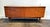Mid Century Modern French sideboard in rich walnut wood with minimalist veneer design at center. Four doors open to reveal...