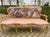 This elegant three-piece French seating set dates to the 1960s and reflects the refined symmetry and decorative character...