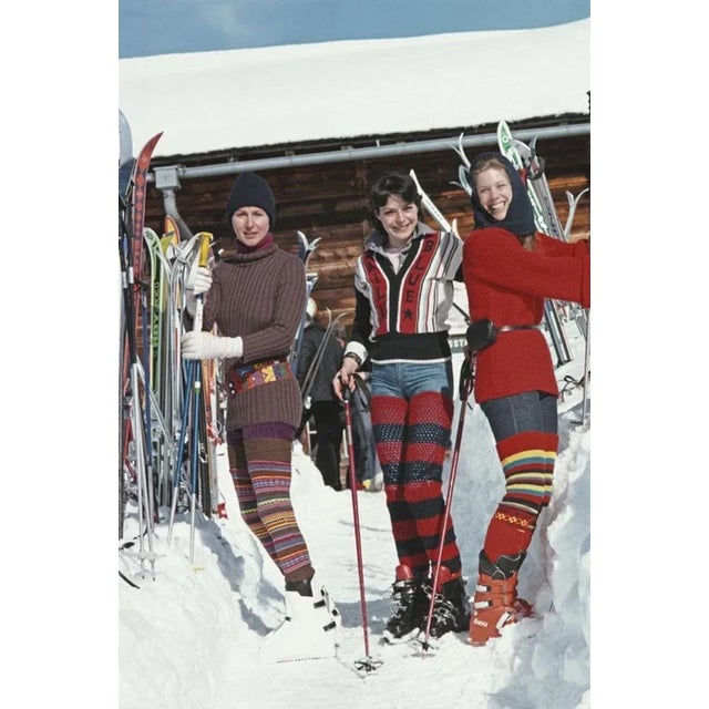 Skiing In Gstaad 1977 by Slim Aarons Slim Aarons Limited Estate Edition Christine Camerana, Caroline Stoop, and Christine...