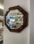 This finely crafted antique octagonal wall mirror features a solid quarter-sawn oak frame with a rich medium-brown finish,...