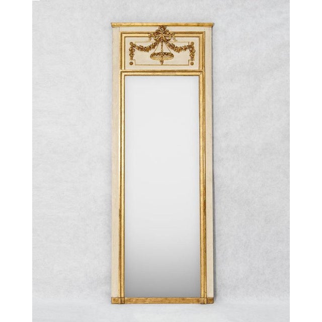 An exceptionally tall and narrow 19th-century mirror with its beautifully preserved original glass plate and original...