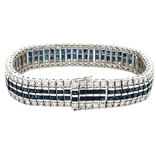 Elegant vintage 1950s tennis bracelet crafted in solid 14K white gold. Featuring approximately 6.32 carats of F/G VS...