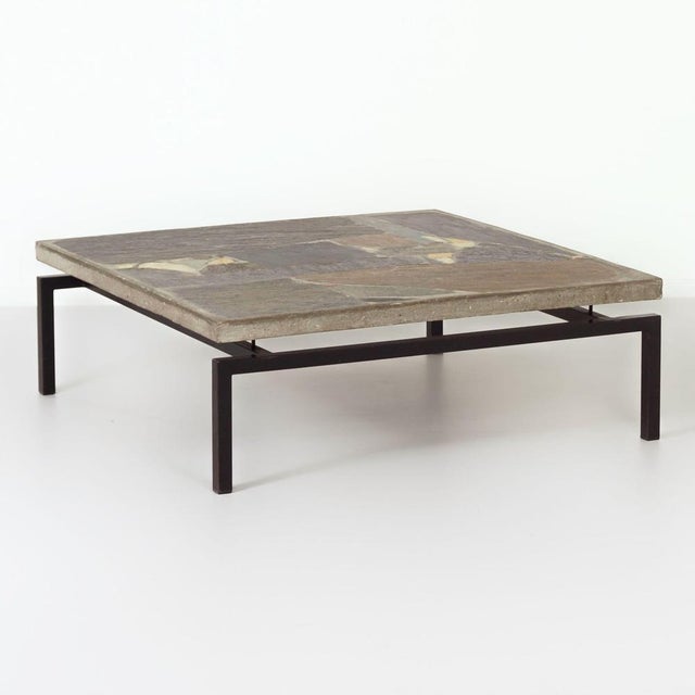 This Paul Kingma coffee table from 1964 is a rare brutalist design with a mosaic top, handcrafted from various types of...