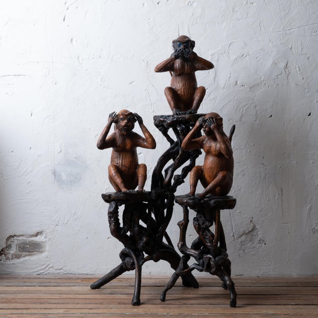 A vintage group of leather wrapped figural sculptures depicting the three wise monkeys. Approximately 11 ½ inches wide by...
