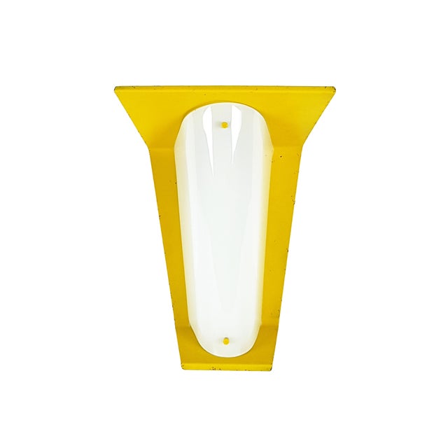 This unique wall lamp was produced in Italy around the early 1960s. It is made from laquered metal body with an opaline...