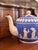 A striking antique Copeland Late Spode teapot crafted in cobalt-blue jasperware with finely applied cream-colored...