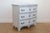 This 18th century Swedish Baroque chest of drawers is a stunning example of Scandinavian craftsmanship. Featuring a gently...