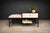Attributed to a Brazilian workshop active in the 1950s, this telephone bench reflects a moment when domestic life was...
