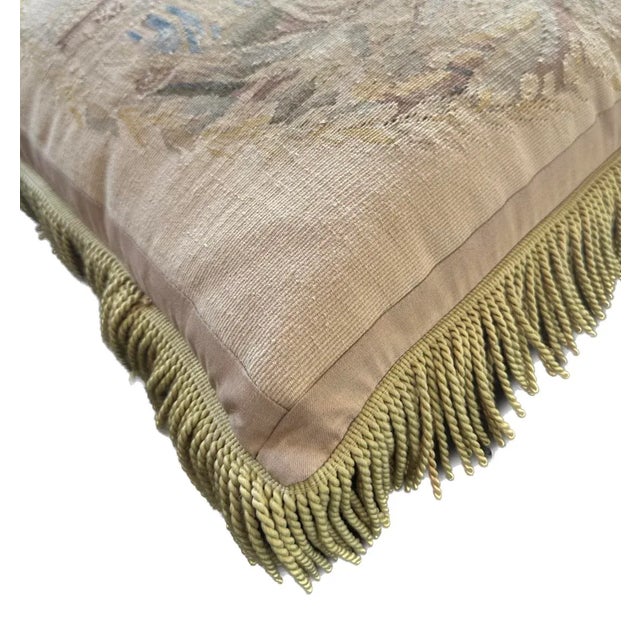 This elegant piece features soothing beige with a touch of blue, complemented by vibrant green tassels. Its unique design...
