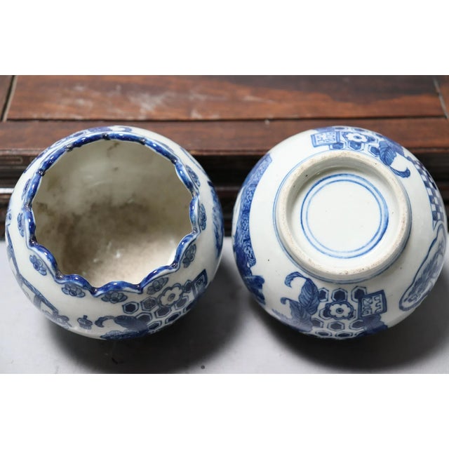 Two delightful matching (but not identical) vintage blue and white porcelain items. 3" tall by 4" wide. No markings on the...