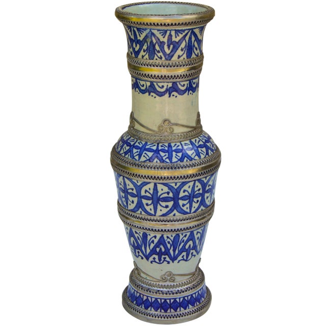 Vintage handcrafted ceramic vase from Fez, Morocco hand-painted with a blue Moorish pattern. Ornate silver inlay and...