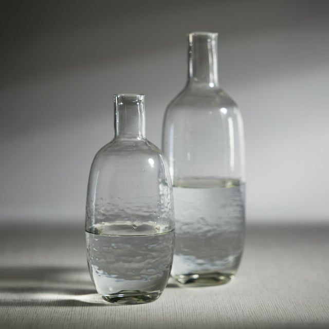 Serve your favorite beverages with a touch of elegance using this Hammered Decanter/Pitcher. Crafted from clear glass,...