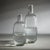 Serve your favorite beverages with a touch of elegance using this Hammered Decanter/Pitcher. Crafted from clear glass,...