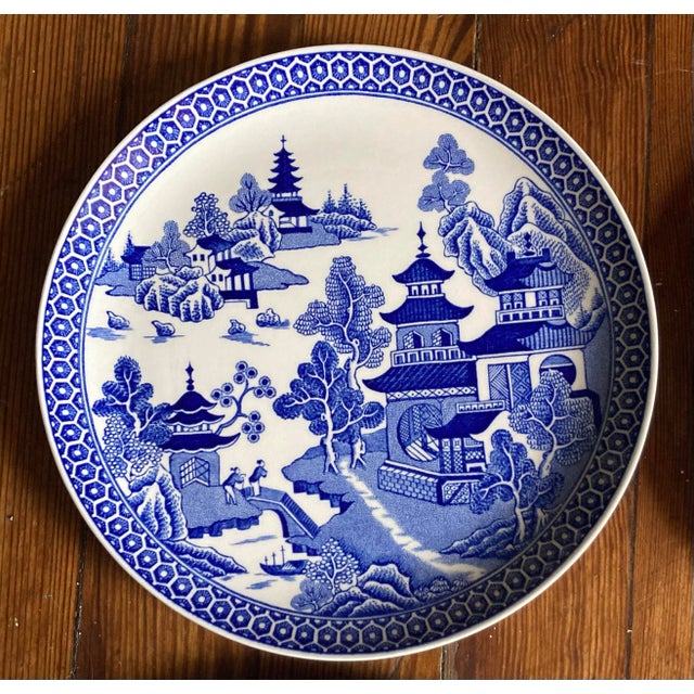 Very pretty set of four Blue Willow salad plates. These are in excellent conditions and would accent your blue and white...