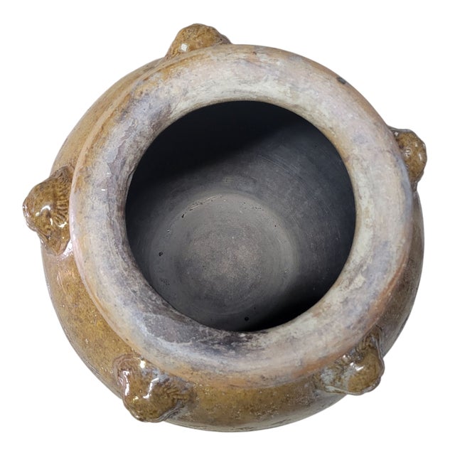 Impressive large antique Chinese Martaban storage jar in glazed brown stoneware, decorated with a stylized dragon design....