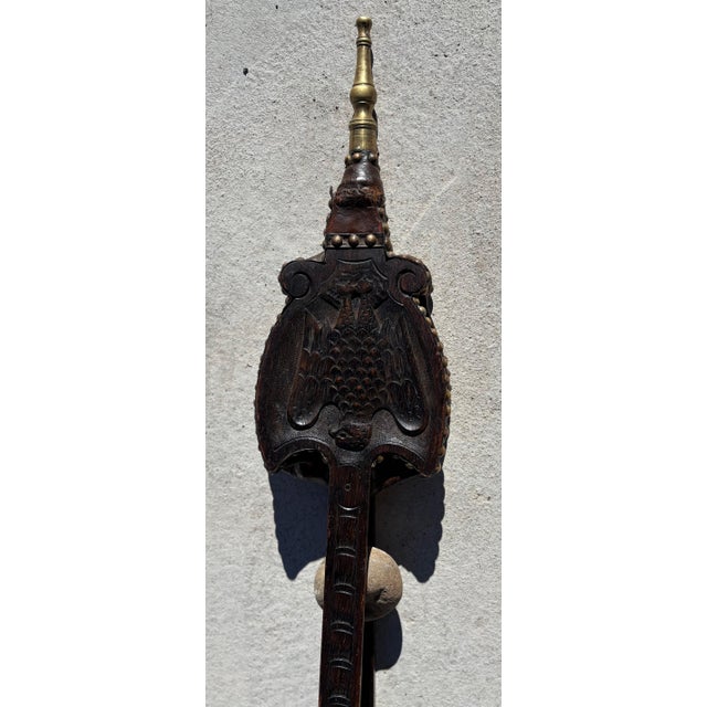 Early American wood and leather bellows with brass nozzle and brass rivet trim. Hand-carved front. Missing some rivets and...