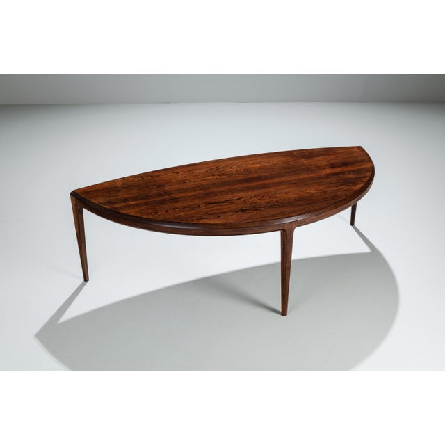 This large vintage “half moon” coffee table by Johannes Andersen is a striking example of refined Scandinavian modern...