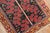 Mid-20th century Persian rug with a colorful Primitive all-over design on a dark background Measures: 2'3" x 3'2".