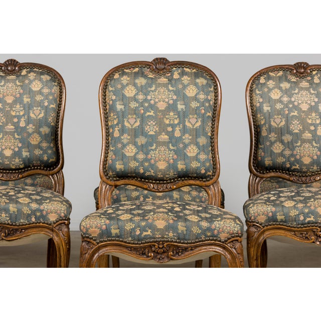 A refined set of twelve late 19th century French Provincial Louis XV dining chairs, sourced in France and structurally...