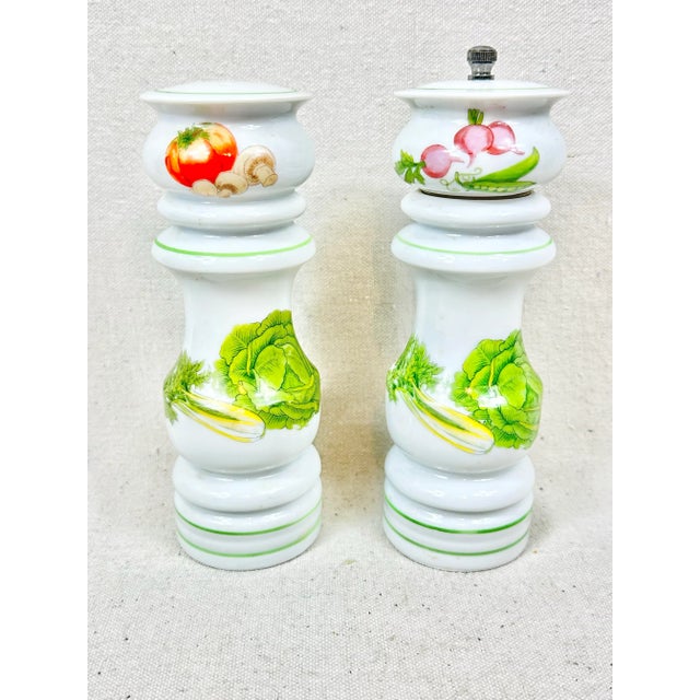 Lovely pair of salt and pepper shakers. Features vegetable designs. Ceramic. Perfect to use daily or when entertaining....