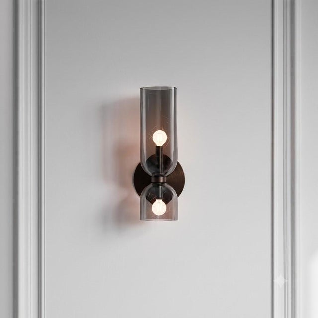 2 x Edie Sconce Dimensions: 13.5"H x 5.5"W x 6"D Finish: Vintage Brass with Clear or Smoked Grey Glass Incandescent bulbs...