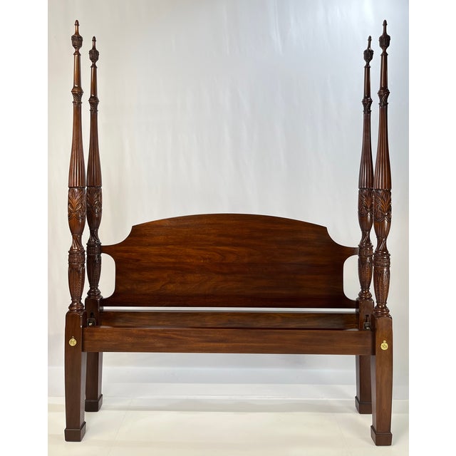 A beautiful and classic Queen-size rice-carved poster bed from the "Virginia Galleries" collection by Henkel Harris....