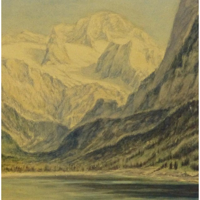 One-of-a-kind original watercolor landscape of a calm lake surrounded by tree covered mountains with grand snow covered...