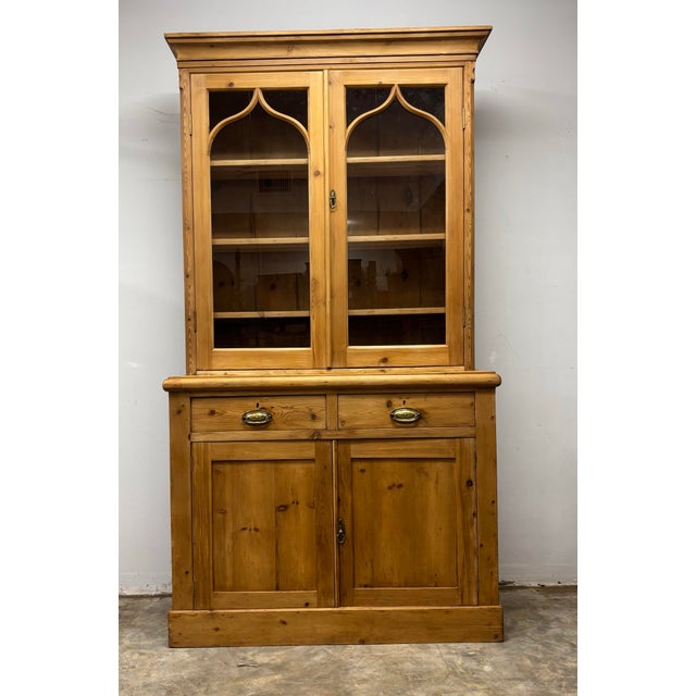This 19th century English pine cabinet is a charming and highly characterful piece, showcasing traditional craftsmanship...
