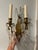 This is a pair of beautiful sconces are elegant and feature two gracefully curved arms crafted from a warm brass. The...