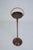 Elegant vintage ashtray stand crafted from solid wood, featuring a turned pedestal base and a circular tray top. The...