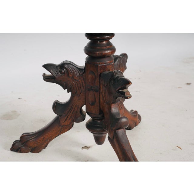 A wonderfully theatrical Continental European music stand, handcrafted from richly figured oak during the late 19th...