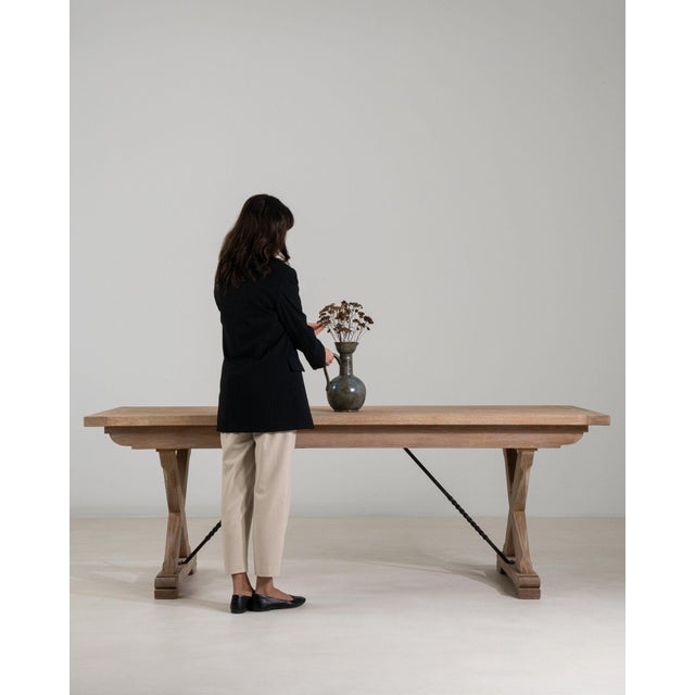 Here is a dining table, its natural bleached oak, trestle X-base the first thing to catch the eye. Dating to 1960s and...