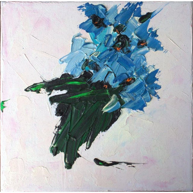 Azure Bloom is an original abstract oil painting featuring a bold blue flower created with expressive impasto...